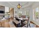 Dining room features a large window, hardwood floors, and modern rustic decor at 770 Tralee Dr, Fayetteville, GA 30215