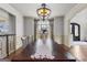 Dining area with a long wooden table, chandelier, and a view of the backyard at 770 Tralee Dr, Fayetteville, GA 30215