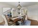 Open-concept dining area showcases a wooden table, chairs, and staircase visible nearby at 770 Tralee Dr, Fayetteville, GA 30215