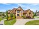 Stately brick home with landscaped front yard and elegant entrance exudes curb appeal at 770 Tralee Dr, Fayetteville, GA 30215