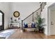 Welcoming foyer featuring hardwood floors, staircase, and stylish décor at 770 Tralee Dr, Fayetteville, GA 30215