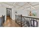Upper-level hallway showcasing coffered ceilings and elegant lighting fixtures at 770 Tralee Dr, Fayetteville, GA 30215