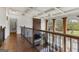 Hallway view overlooking the Gathering room with large windows and coffered ceilings at 770 Tralee Dr, Fayetteville, GA 30215