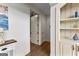 Neutral hallway features wood floors and detailed trim at 770 Tralee Dr, Fayetteville, GA 30215