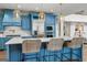 Kitchen with marble countertops, stainless appliances, and barstool seating at the kitchen island at 770 Tralee Dr, Fayetteville, GA 30215