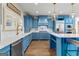 Kitchen with marble counters, stainless appliances, designer cabinetry, and barstool seating at 770 Tralee Dr, Fayetteville, GA 30215