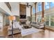 Spacious living room with high ceilings, large windows, and a stone fireplace at 770 Tralee Dr, Fayetteville, GA 30215