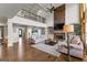 Spacious living room features hardwood floors, stone fireplace, coffered ceiling, and an open floor plan at 770 Tralee Dr, Fayetteville, GA 30215