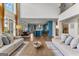 Bright living room showcasing the open floorplan with views of the dining and kitchen at 770 Tralee Dr, Fayetteville, GA 30215