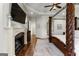 Bright main bedroom features a fireplace, hardwood floors, and a four-poster bed at 770 Tralee Dr, Fayetteville, GA 30215