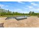 A luxurious pool with jacuzzi, travertine deck, and manicured lawn, perfect for relaxation and outdoor enjoyment at 770 Tralee Dr, Fayetteville, GA 30215