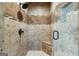 Tiled shower with glass door, rainfall shower head and built-in seat at 770 Tralee Dr, Fayetteville, GA 30215