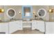 Bright bathroom featuring a vanity with double sinks and granite countertops at 770 Tralee Dr, Fayetteville, GA 30215