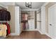 Large walk-in closet with custom shelving and hardwood floors at 770 Tralee Dr, Fayetteville, GA 30215