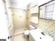 Bathroom featuring a tiled shower, hexagon tile flooring, and neutral-toned floral wallpaper at 2425 Wood Valley Dr, Morrow, GA 30260