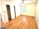 Bedroom with hardwood floors, neutral paint and a ceiling fan at 2425 Wood Valley Dr, Morrow, GA 30260