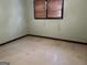 Bedroom with tan tile floors, green walls and a window at 2425 Wood Valley Dr, Morrow, GA 30260