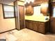 Kitchen featuring wood cabinets, yellow countertops, and a window for natural light at 2425 Wood Valley Dr, Morrow, GA 30260