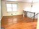 Spacious living room with hardwood flooring, natural light, and a staircase at 2425 Wood Valley Dr, Morrow, GA 30260