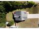 Aerial view of a home with a large backyard, deck, and a well-maintained lawn and mature trees in the background at 10074 Tara Glynn Dr, Hampton, GA 30228