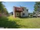 The back of the house features a raised deck and a walkout basement at 10074 Tara Glynn Dr, Hampton, GA 30228