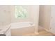 Bathroom featuring a soaking tub and tiled walk-in shower at 10074 Tara Glynn Dr, Hampton, GA 30228