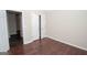 Bedroom with closet and doorframe features modern, sleek wood flooring at 10074 Tara Glynn Dr, Hampton, GA 30228