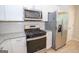 Updated kitchen features granite counters and stainless-steel appliances at 10074 Tara Glynn Dr, Hampton, GA 30228