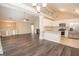 Open floor plan showcasing living room, modern kitchen with stainless steel appliances, and dining area with lots of light at 10074 Tara Glynn Dr, Hampton, GA 30228