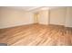 Large living room featuring wood-style flooring and recessed lighting at 10074 Tara Glynn Dr, Hampton, GA 30228