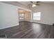 Open floor plan living room with lots of natural light, vaulted ceiling, dining area and modern floors at 10074 Tara Glynn Dr, Hampton, GA 30228