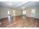 Spacious living room with recessed lighting and wood-style flooring at 10074 Tara Glynn Dr, Hampton, GA 30228