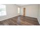 Open main bedroom boasts hard wood floors and natural light at 10074 Tara Glynn Dr, Hampton, GA 30228