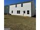 Backyard with a spacious lawn and white siding at 136 Paulownia Cir, Mcdonough, GA 30253
