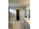 Bathroom with a soaking tub, shower, tile floor, and white vanity at 136 Paulownia Cir, Mcdonough, GA 30253