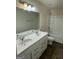 Bathroom featuring a double vanity sink, mirror, tile floor, and shower-tub combo at 136 Paulownia Cir, Mcdonough, GA 30253