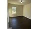Cozy bedroom featuring a window with natural light and ample space at 136 Paulownia Cir, Mcdonough, GA 30253