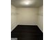 Walk-in closet with dark wood-look floors and wire shelving at 136 Paulownia Cir, Mcdonough, GA 30253
