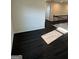 Hallway with dark hardwood floors and white trim at 136 Paulownia Cir, Mcdonough, GA 30253
