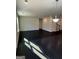 Expansive living room featuring dark wood floors, neutral paint, recessed lighting, and an open layout at 136 Paulownia Cir, Mcdonough, GA 30253