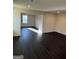 Open living room with hardwood floors and recessed lighting at 136 Paulownia Cir, Mcdonough, GA 30253