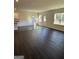 Bright living room featuring hardwood floors and natural light at 136 Paulownia Cir, Mcdonough, GA 30253