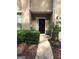 Beige two-story home with a dark-colored front door, symmetrical design, and a well-maintained lawn at 2320 Coach Way, Jonesboro, GA 30236