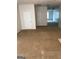 Spacious living room featuring neutral carpet, white doors, and an open floor plan, great for entertaining at 2320 Coach Way, Jonesboro, GA 30236