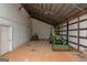 Spacious barn featuring equipment storage with high ceilings and natural light at 877 Honey Creek Rd, Mcdonough, GA 30252