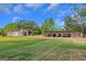 Exterior shot of two barns and a grassy field under a blue sky with white clouds at 877 Honey Creek Rd, Mcdonough, GA 30252