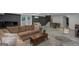Relaxing basement space includes a lounge area, stairs, a dining set, and access to the outdoors at 877 Honey Creek Rd, Mcdonough, GA 30252
