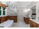 Modern bathroom with a standalone tub, glass shower, and double vanities at 877 Honey Creek Rd, Mcdonough, GA 30252