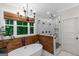 Bright bathroom with a soaking tub, a large window, and glass-enclosed shower at 877 Honey Creek Rd, Mcdonough, GA 30252