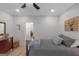 Bedroom featuring a cozy bed, hardwood floors, and stylish decorations at 877 Honey Creek Rd, Mcdonough, GA 30252